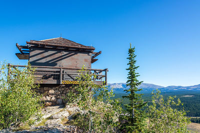 Low angle view of built structure against clear blue sky