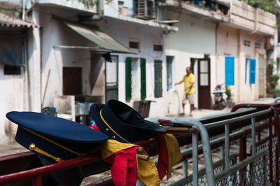 People in boat against building in city