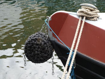 High angle view of rope tied on boat moored in lake