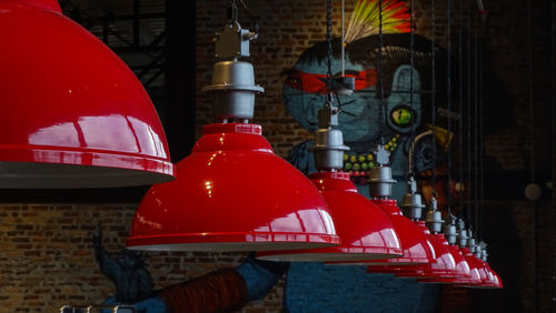 Close-up of red lanterns hanging on building