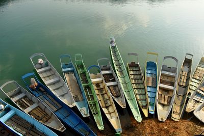 High angle view of boats moored at lakeshore