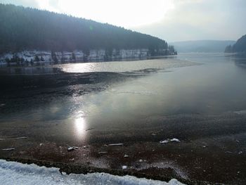 Scenic view of frozen lake against sky