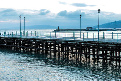 Pier over sea against sky