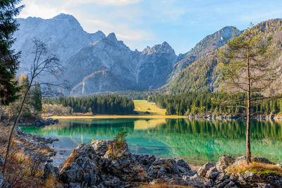 Amazing alpine lake under mountains on a sunny day in autumn