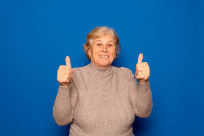 Portrait of boy holding thermometer