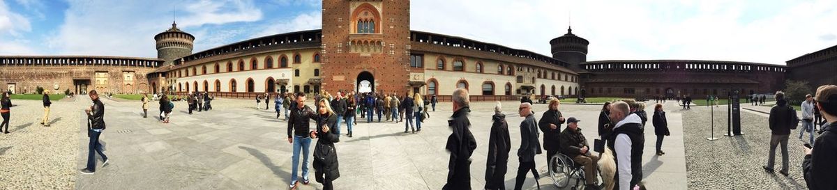 Tourists in front of building