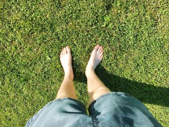 Low section of man relaxing on grass