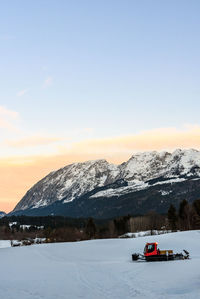 Scenic view of snowcapped mountains against sky during winter