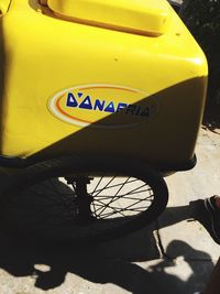 High angle view of bicycle on yellow shadow