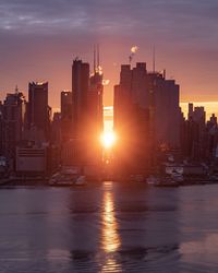 Scenic view of buildings against sky during sunset