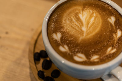 High angle view of cappuccino on table