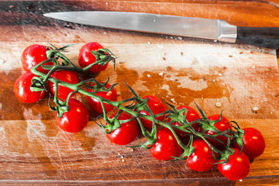 High angle view of tomatoes on cutting board