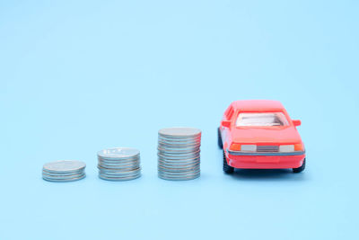 Close-up of coins over white background