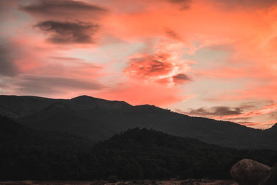 Scenic view of mountains against sky during sunset