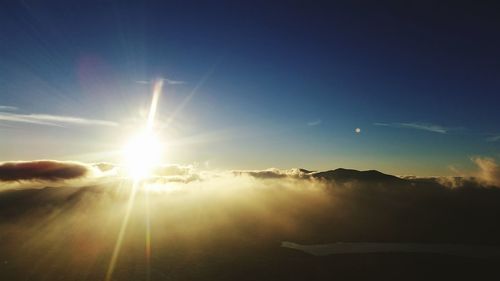 Scenic view of vapor trail in sky during sunset