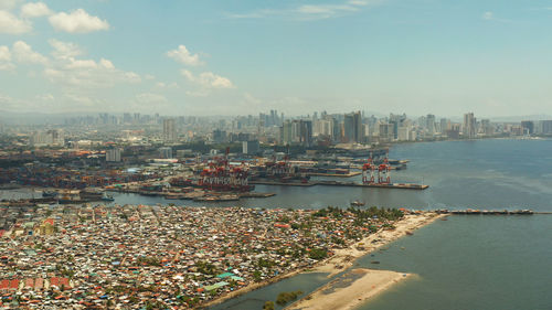 Cityscape of the capital of the philippines manila with the port and business centers, skyscrapers. 