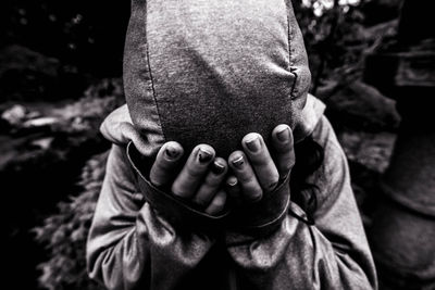 Close-up of man holding hands