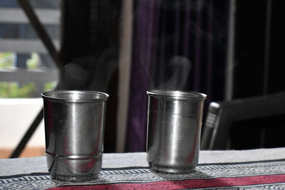 Close-up of tea cups on table at home