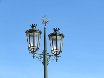 Low angle view of lamp post against clear sky