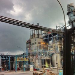 Low angle view of building against cloudy sky