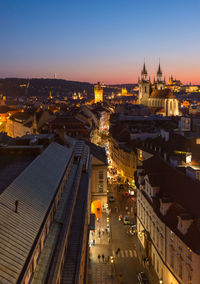 Vibrant evening view of prague highlighting historic architecture and lively streets