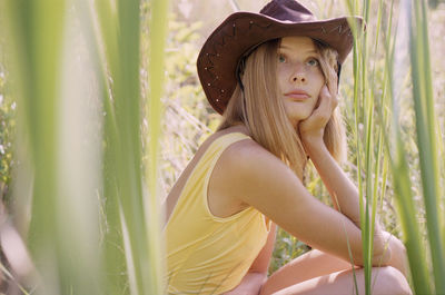 Portrait of young woman wearing hat