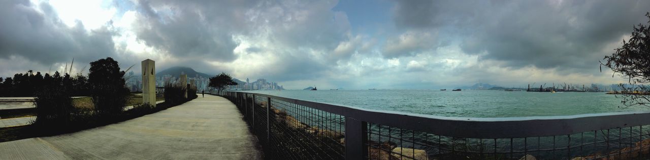 sky, sea, water, cloud - sky, horizon over water, beach, cloudy, the way forward, built structure, cloud, scenics, architecture, nature, shore, tranquility, tranquil scene, beauty in nature, incidental people, sand, railing