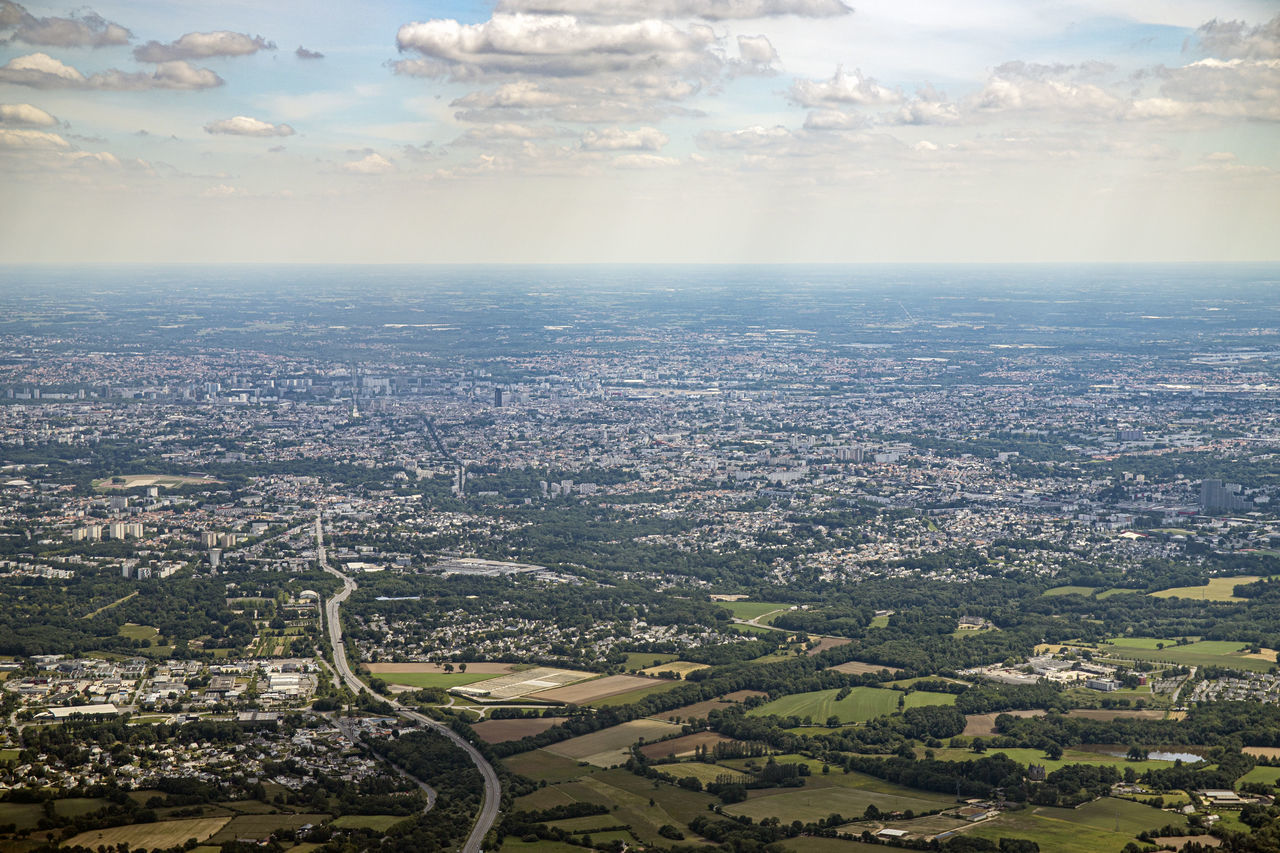 AERIAL VIEW OF CITY BUILDINGS AGAINST SKY