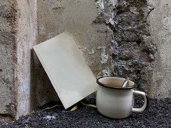 Close-up of coffee cup on wall