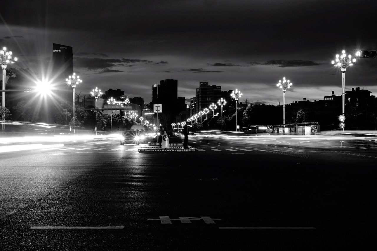 VIEW OF CITY STREET AT NIGHT