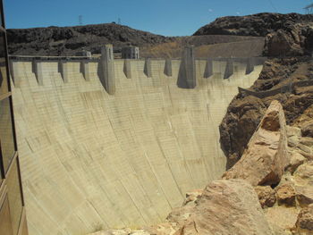 High angle view of dam on mountain against sky