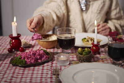 Mid section of woman at christmas table