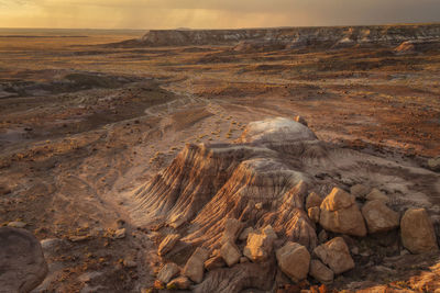 Scenic view of rocks on land against sky