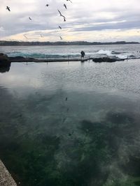 Scenic view of beach against sky