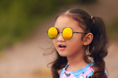 Close-up portrait of a girl looking away