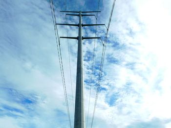 Low angle view of cables against blue sky