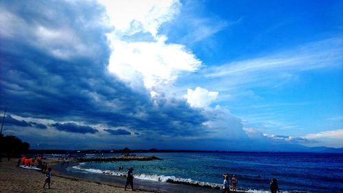 Scenic view of sea against cloudy sky