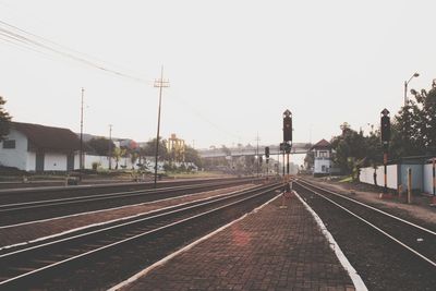 Railroad station platform against clear sky