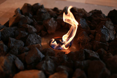 Close-up of fire amidst stones