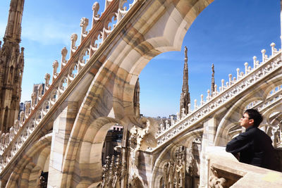 Low angle view of man standing in historical building