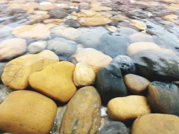 Full frame shot of pebbles at beach