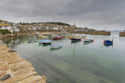 Boats in sea against sky