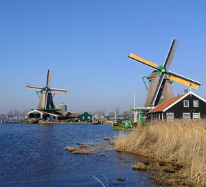 Traditional windmill against clear blue sky