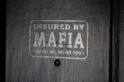 Close-up of text on wall