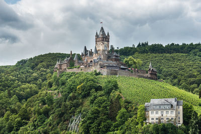 Low angle view of cochem imperial castle on mountain