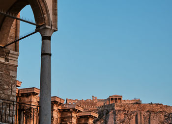 Low angle view of historic building against clear blue sky