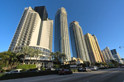 Low angle view of skyscrapers against clear sky