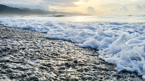 Gorgeous shot of waves washing onto the kingston shoreline 