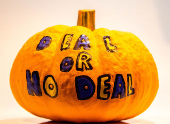 Close-up of pumpkin against yellow background