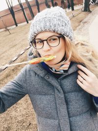 High angle view of woman eating lollipop